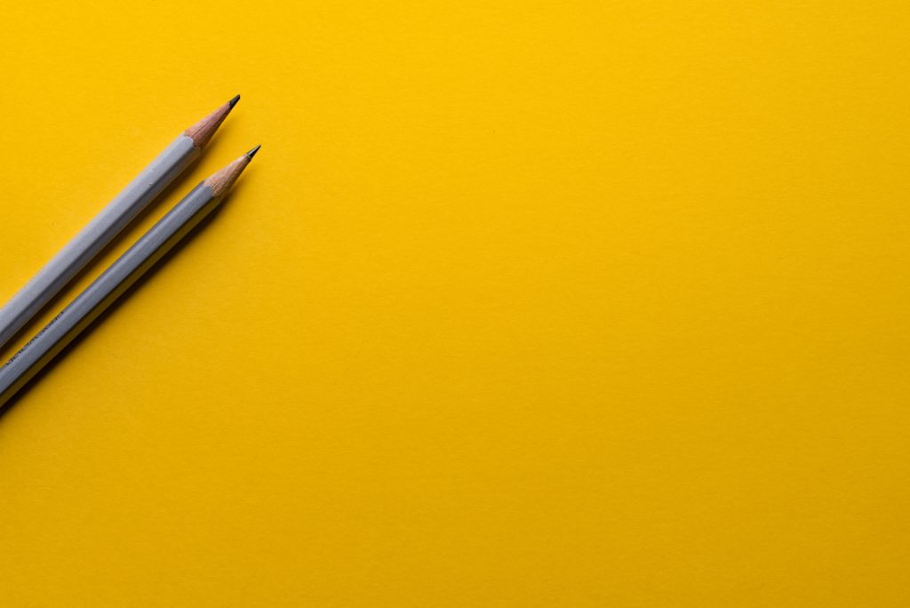 pencils on a bright yellow background